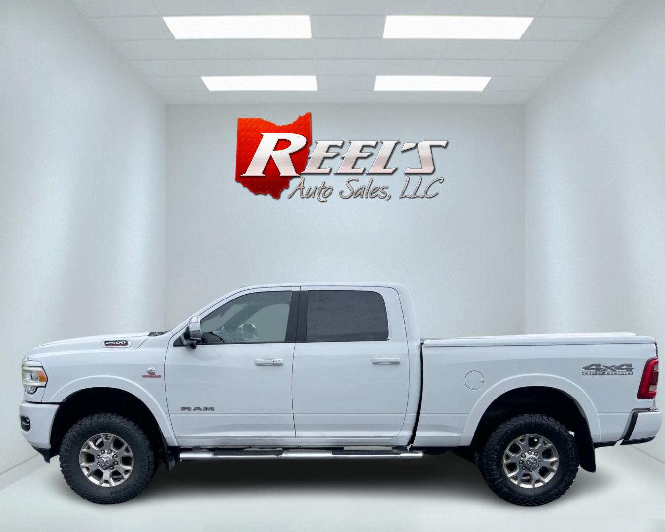 2020 White /Black RAM 2500 Laramie Crew Cab SWB 4WD (3C6UR5FL7LG) with an 6.7L I6 OHV 24V TURBO DIESEL engine, 6A transmission, located at 11115 Chardon Rd. , Chardon, OH, 44024, (440) 214-9705, 41.580246, -81.241943 - This 2020 Ram 2500 Laramie Crew Cab is a powerhouse pickup truck designed for serious towing and hauling capabilities. Under the hood lies a 6.7L Cummins Turbo Diesel engine mated to a 6-speed 68RFE transmission with 3.73 gearing, producing an impressive 370 hp and a staggering 850 lb-ft of torque. - Photo#8